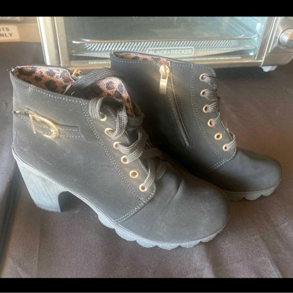 Stylish Black Lace-Up Boots with Gold Details